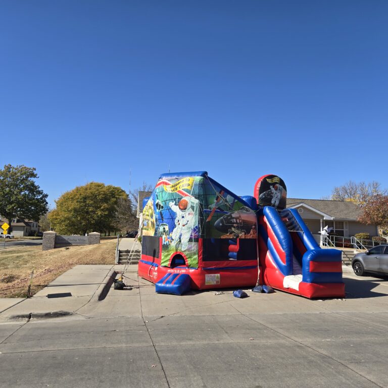 HOA event rentals Omaha Nebraska with inflatables and setup for a neighborhood block party