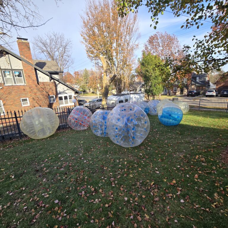 HOA and Block Party Rentals Omaha – inflatable bubble balls set up in neighborhood yard for outdoor games