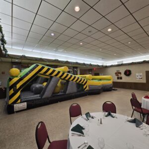 Inflatable obstacle course setup indoors for event – Omaha bounce house delivery by Jumpers4You
