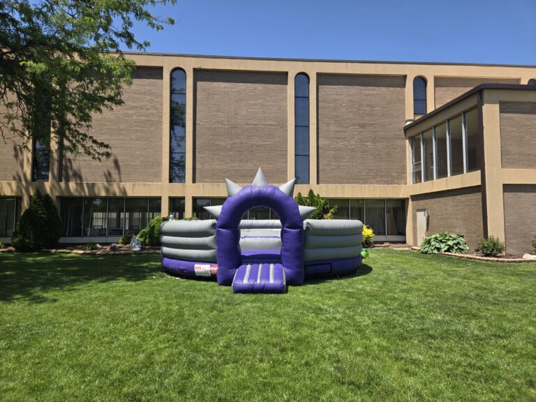 Inflatable rental set up on a church lawn for non-profit event rentals Omaha organizations trust.