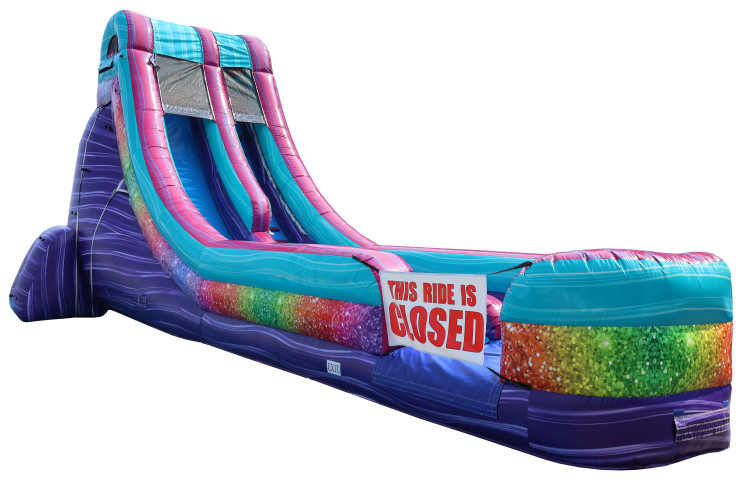Big Splash Glitter water slide viewed from the splash-lane side, with pink, teal and purple panels