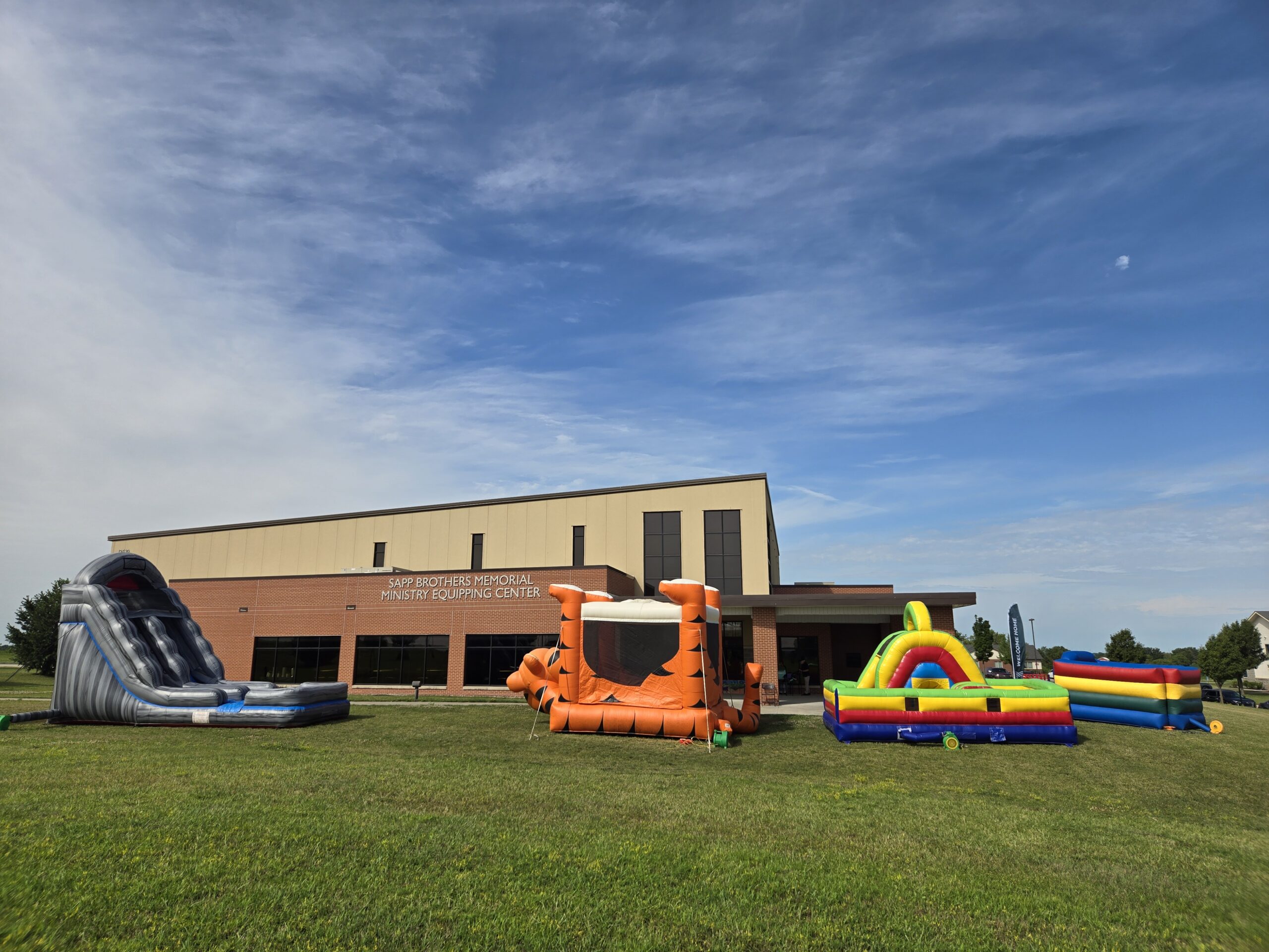 Church Event Rentals Omaha multi-attraction setup outside a church