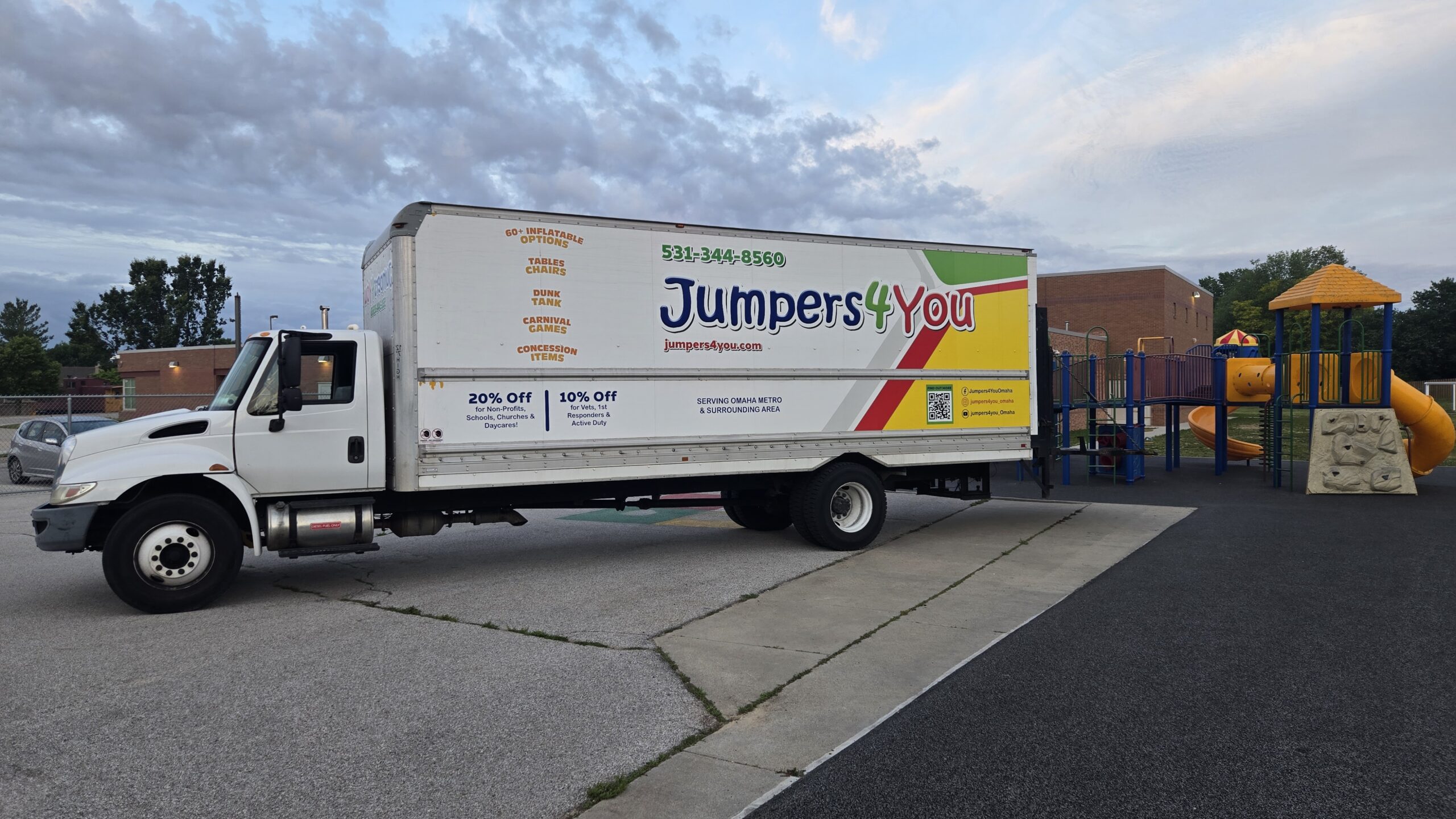 Jumpers4You party rental delivery truck serving an Omaha birthday